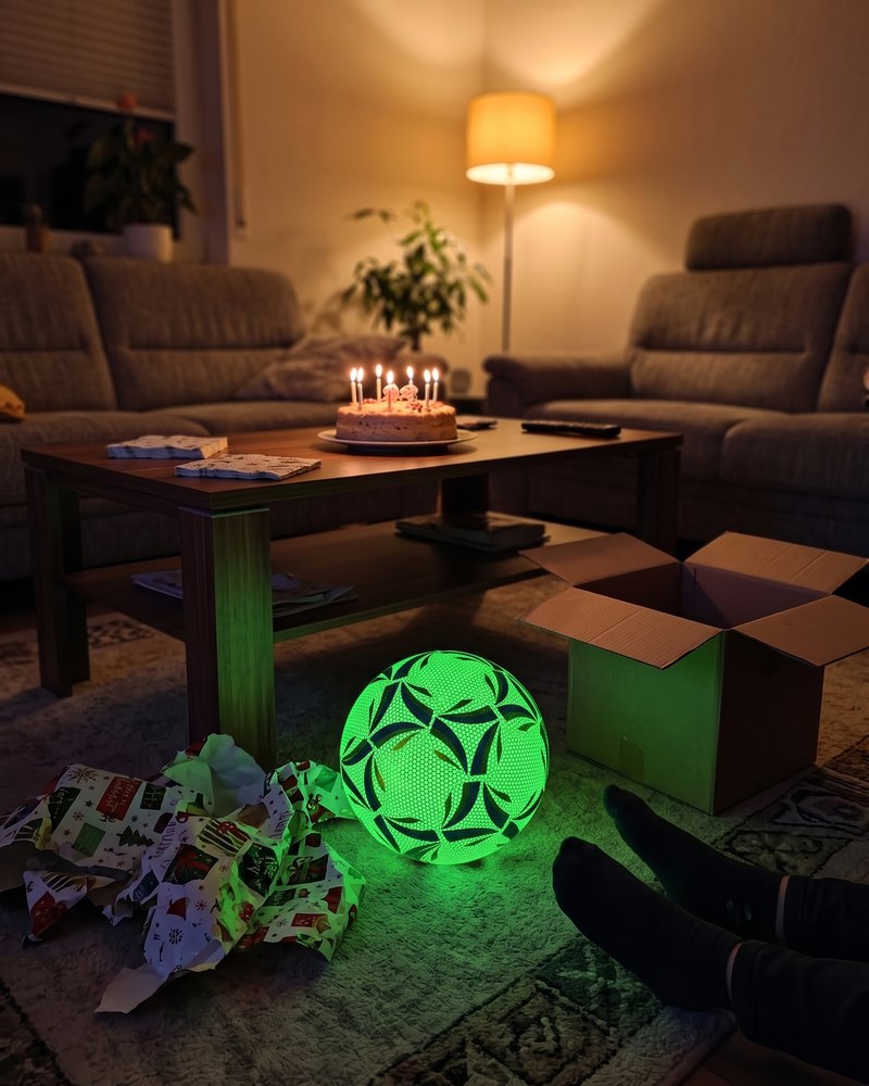Glowing football as a birthday present in the living room